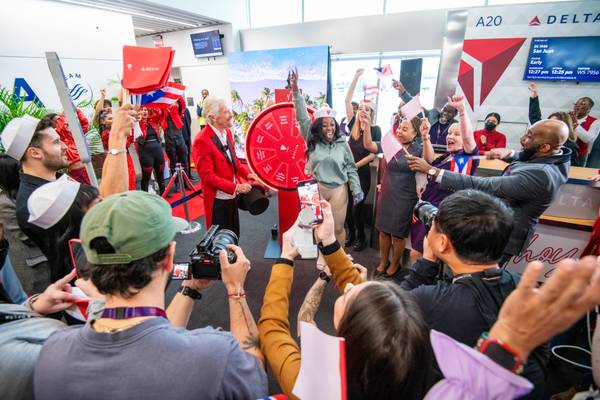 Sir Richard Branson surprises some Delta flyers in Atlanta with free vacation