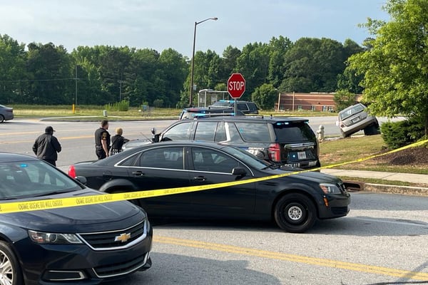 Woman found shot to death after car crashes in DeKalb County