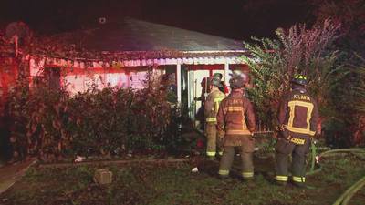 Atlanta firefighter hospitalized after battling house fire, officials say