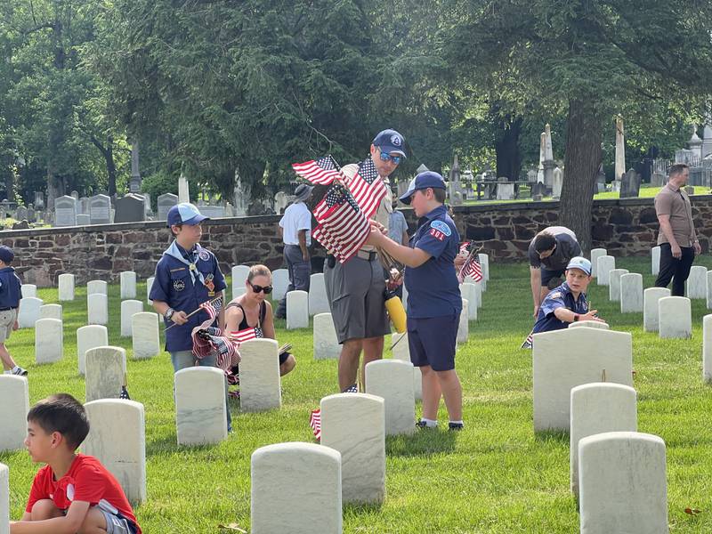 Flags placed at Alexandria National Cemetery in Alexandria, Virginia with the help of the National Capitol Area Council scouts in honor of fallen servicemembers.