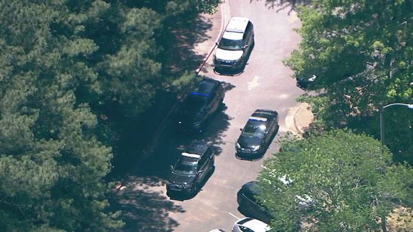 Lockdown lifted at metro middle school as search for home invasion suspects continues