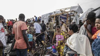 Bomb kills at least 12 people, including children, at two displacement camps in eastern Congo