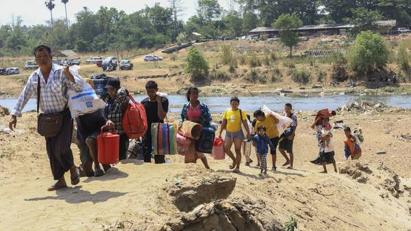 About 1,300 people from Myanmar flee into Thailand after clashes broke out in a key border town