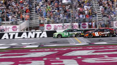 Daniel Suarez wins a chaotic, crowded, wreck-filled Atlanta race at the line