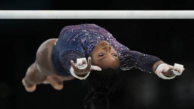Simone Biles submits an original skill on uneven bars ahead of Paris Olympics
