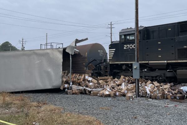 Train crashes into tractor-trailer carrying Whataburger supplies in Clayton County, crew members say