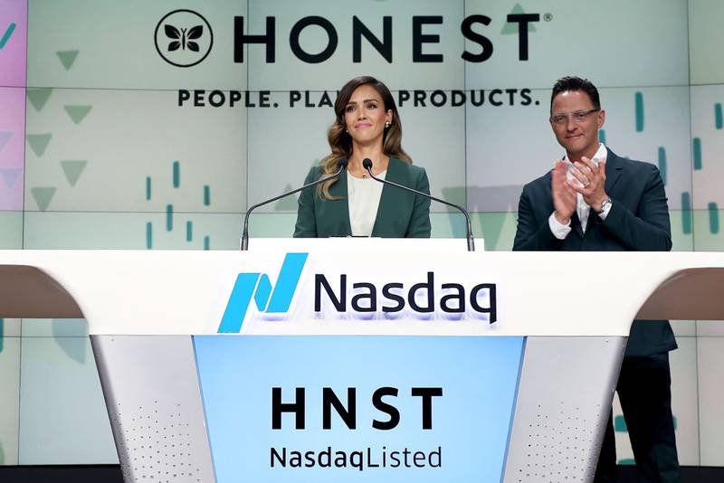 NEW YORK, NEW YORK - MAY 05: The Honest Company founder and chief creative officer Jessica Alba and The Honest Company CEO Nick Vlahos ring the Nasdaq Stock Market opening bell to mark the company's IPO at NASDAQ MarketSite on May 05, 2021 in New York City. (Photo by Dimitrios Kambouris/Getty Images for The Honest Company )
