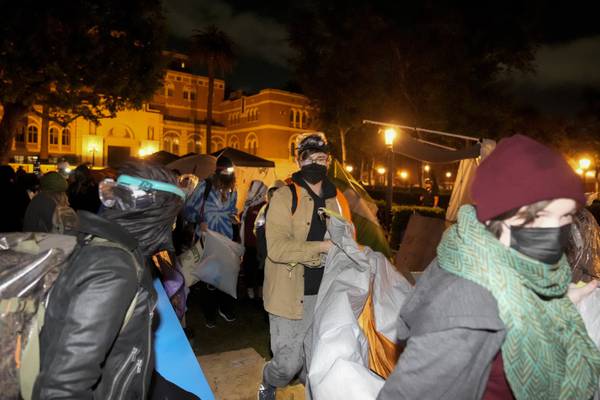 Anti-war protesters leave USC after police arrive, while Northeastern ceremony proceeds calmly
