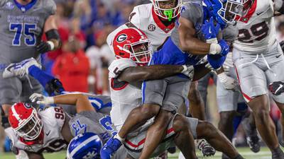 No. 1 Georgia escapes with narrow win at Kentucky