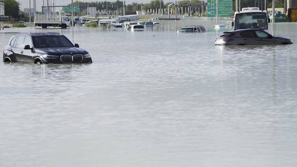 A storm dumps record rain across the desert nation of UAE and floods Dubai's airport
