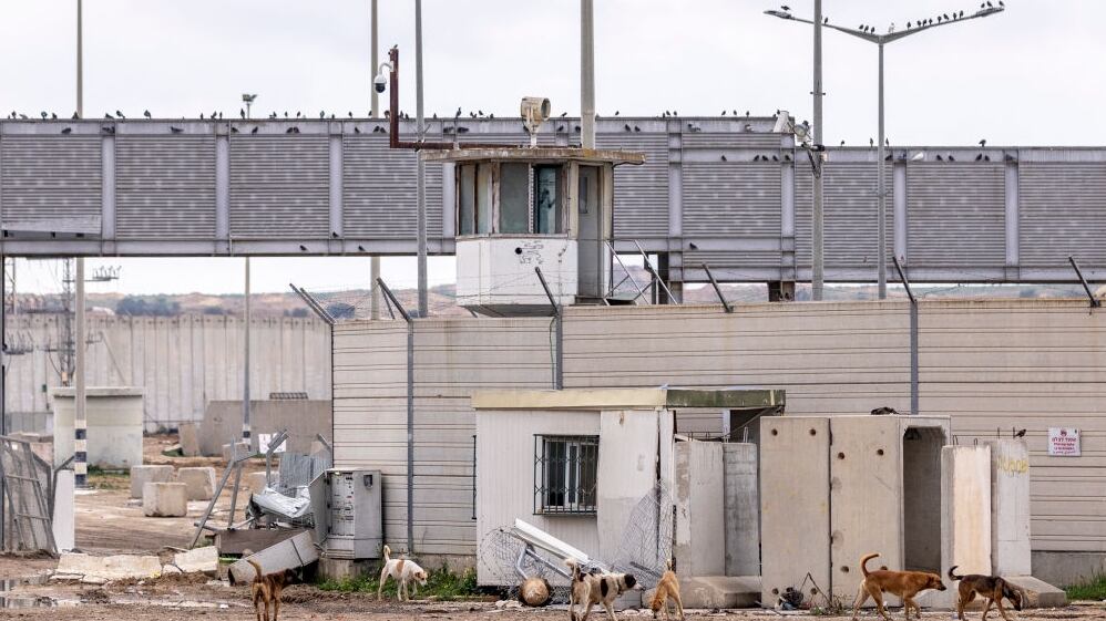 SOUTHERN ISRAEL - JANUARY 03: Dogs walk near the entrance to the damaged Erez Crossing, one of the sites attacked on October 7th 2023, on January 03, 2024 in Southern Israel. Prior to annnouncing the withdrawal of some troops from Gaza, Israel extended its ground offensive into densely populated neighborhoods in the central part of the territory, forcing a fresh wave of displacement to south. Meanwhile, its aerial campaign continued apace across the territory as it seeks to destroy Hamas following the militant group's Oct. 7 attack, which left 1,200 dead and scores of Israelis held hostage. In the ensuing war, more than 21,000 have been killed in Gaza, according to the territory's Hamas-run health ministry. (Photo by Maja Hitij/Getty Images)