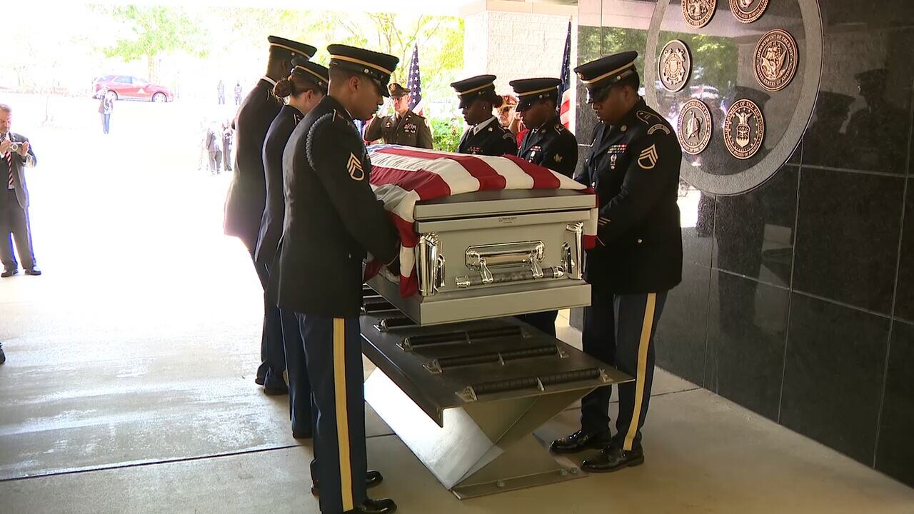 The remains of Army Cpl. Anthony Konze were carried in for his funeral before his internment at Georgia National Cemetery in Canton.