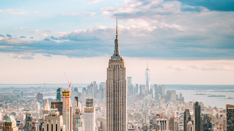 2 people seen climbing Empire State Building, fly banner