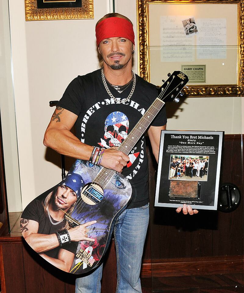NEW YORK, NY - JULY 18: Singer/TV personality Bret Michaels poses for a photo with the guitar he donated to Hard Rock Cafe at Hard Rock Cafe New York on July 18, 2014 in New York City. (Photo by Stephen Lovekin/Getty Images)