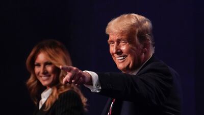President Donald Trump and first lady Melania Trump walks off stage at the end of the first presidential debate Tuesday, Sept. 29, 2020, at Case Western University and Cleveland Clinic, in Cleveland, Ohio.