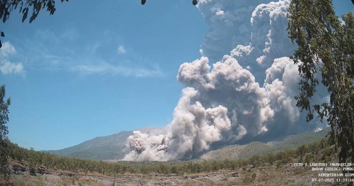 Residents wear masks as volcanic ash blankets villages near erupting Indonesian volcano