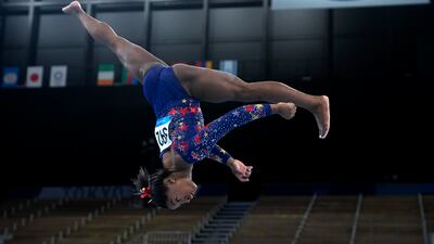 Simone Biles, of the United States, performs on the balance beam during the women's artistic gymnastic qualifications at the 2020 Summer Olympics, Sunday, July 25, 2021, in Tokyo.