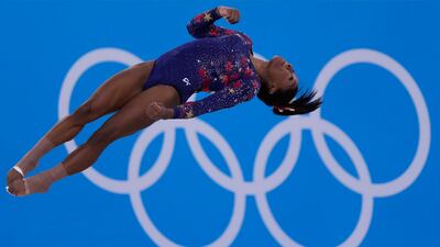 Simone Biles, of United States, performs her floor exercise routine during the women's artistic gymnastic qualifications at the 2020 Summer Olympics, Sunday, July 25, 2021, in Tokyo.