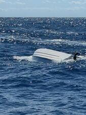 This image provided by the U.S. Coast Guard on Monday, April 14, 2025, shows a capsized boat off Florida's Atlantic Coast. (U.S. Coast Guard via AP)