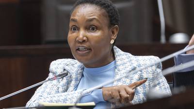 South Africa's justice minister denies corruption allegations against her in a mutual bank scandal